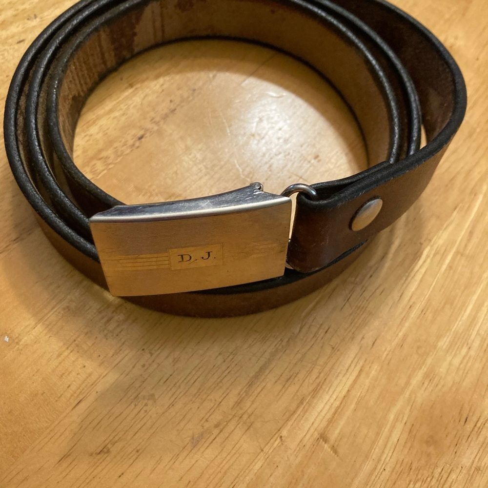 Vintage leather belt with Krementz Monel silver tone buckle.